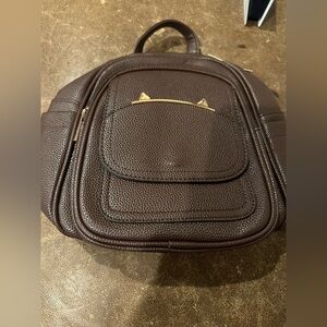 Brown mini backpack. Condition (new)
